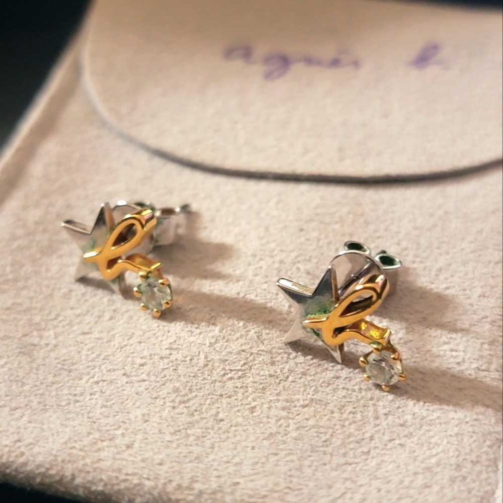 Agnes b stub earrings with its signature b on top of a star